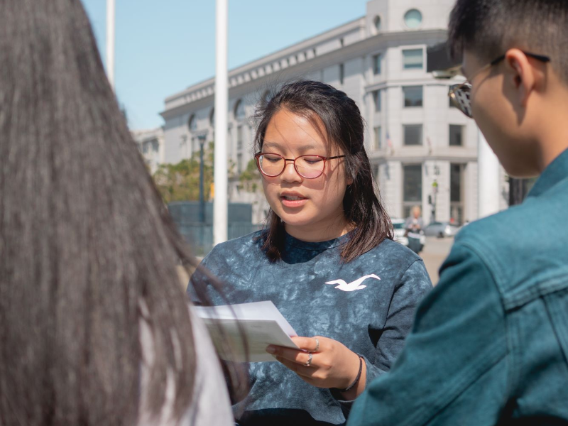 A mentor discusses leadership skills with students